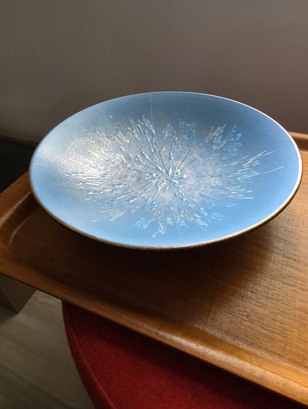 Mid-Century Modern West German pottery bowl featuring a blue "atomic" starburst